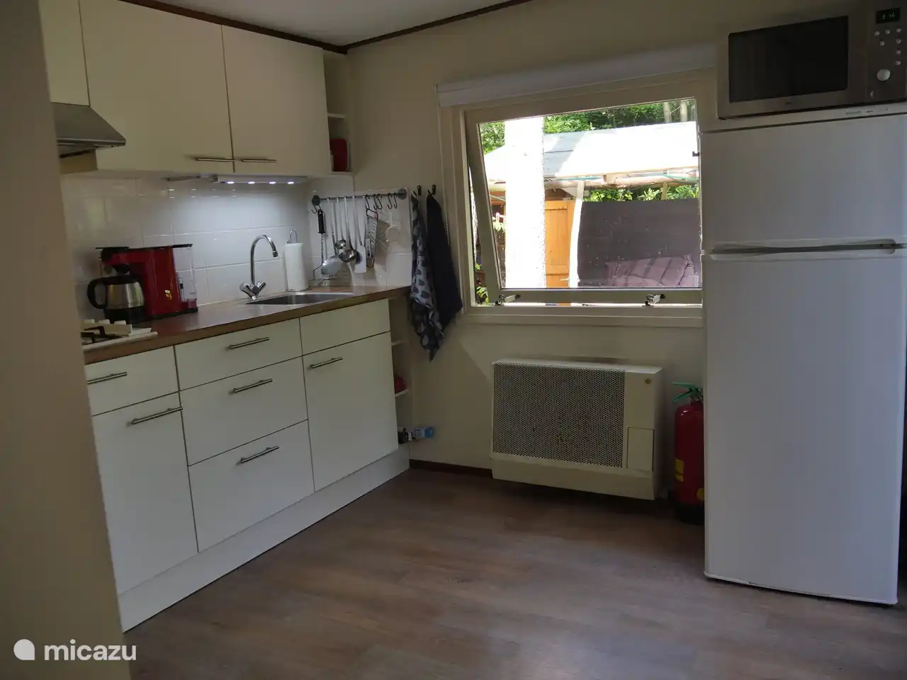 Kitchen with fridge-freezer and oven