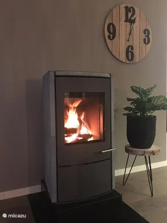 The soapstone stove gives off pleasant warmth.