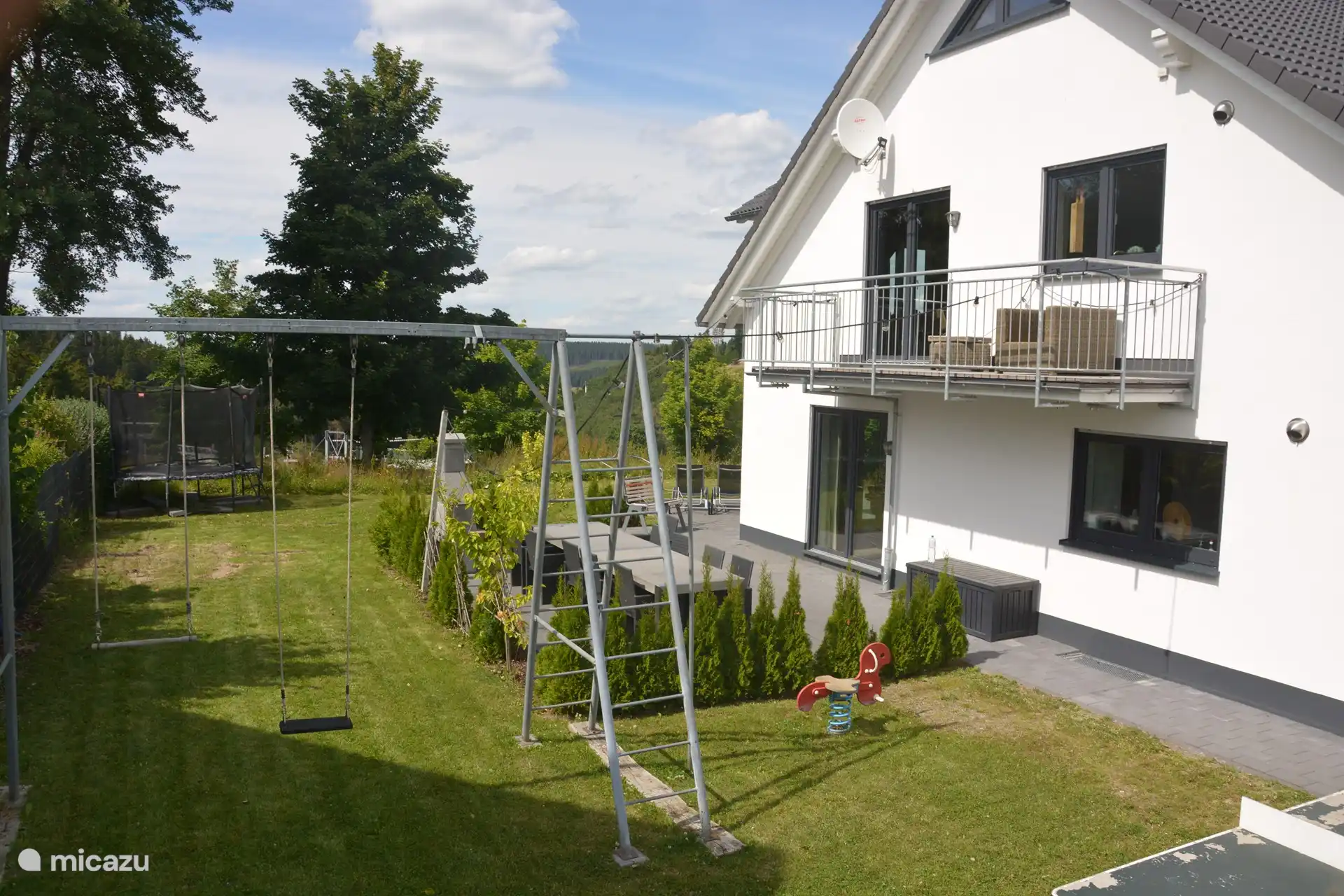 For the children there is a large climbing frame with swing, a slide, seesaw and table tennis table in the garden