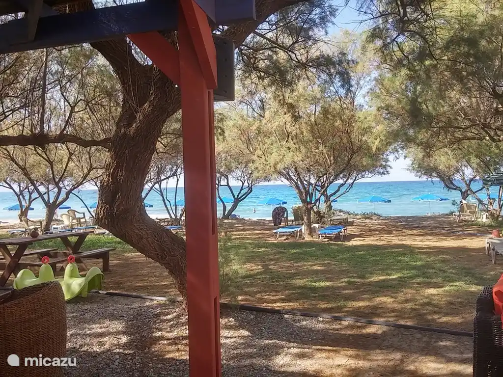Relaxed beach at Episkopi, enjoy the shade under the trees.