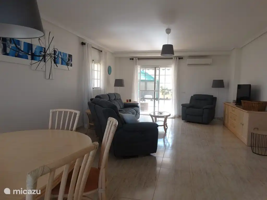 Living room with 6 person sofa, the television has an international channel package including pay channels (Ziggo sport, Honor Division live etc)