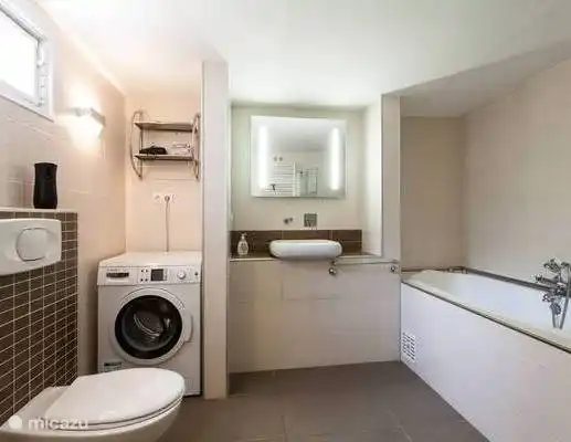 Bathroom with bath, separate shower and toilet. Hairdryer available. Washing machine.