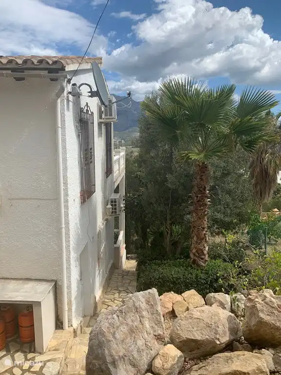 Outdoor stairs to shadow terrace, outdoor shower and swimming pool.
