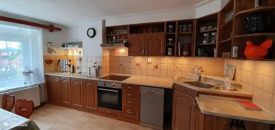 Kitchen with coffee maker and kettle.