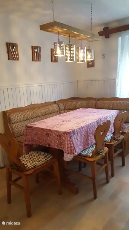 Cozy dining table with corner bench in the kitchen.