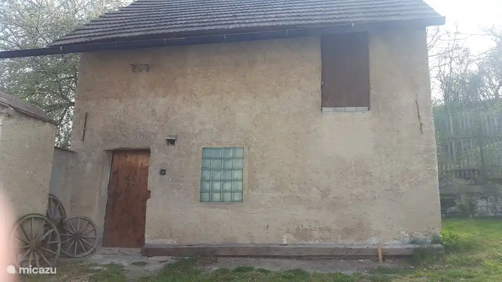 Shed where the garden furniture and bicycles are but where there is also enough space to store your own bicycles.