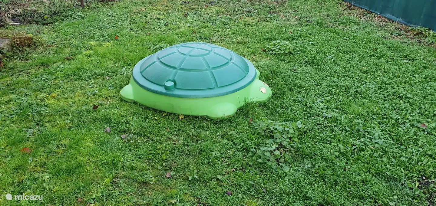 The small children have also been thought of, a sandbox to play in.