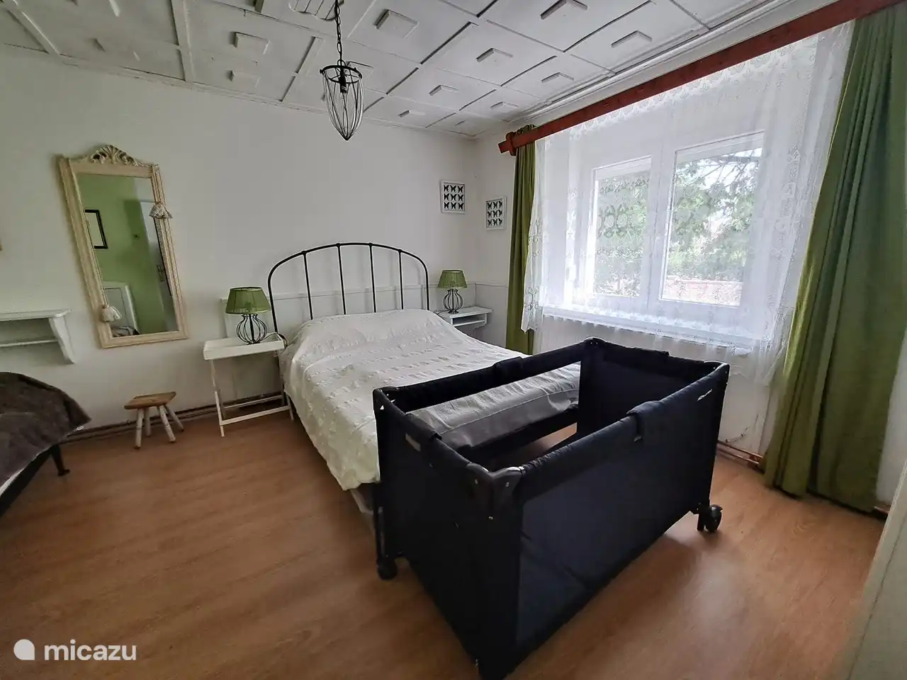 A camp bed is present