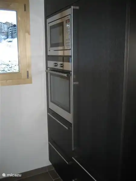 Oven, microwave and refrigerator.