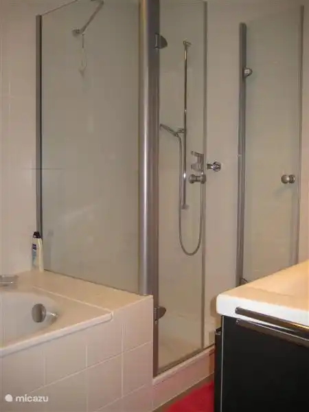 There are 2 bathrooms with bath and shower, 1 bathroom with shower.