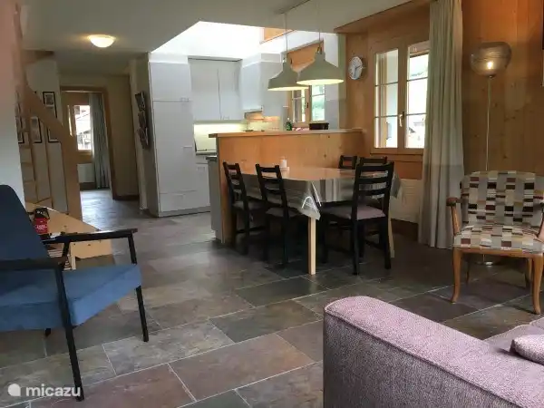 View of dining table and kitchen