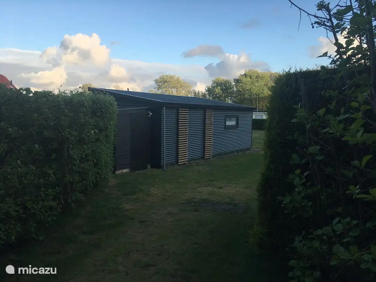 View of TinyHouseTerschelling from the forest path.
