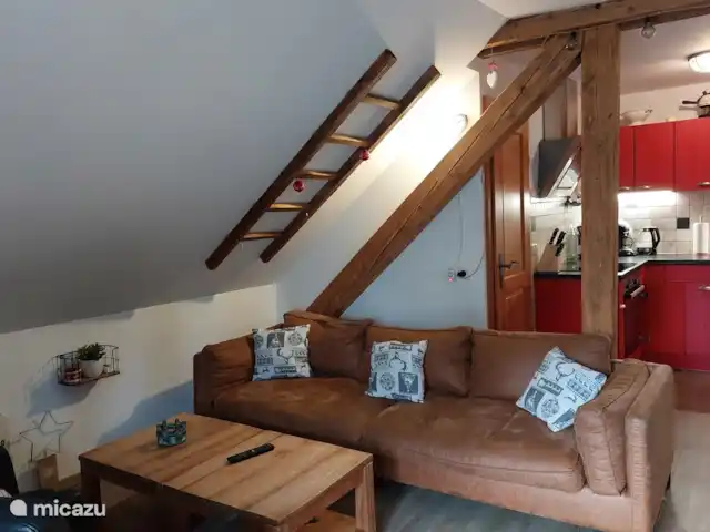 appartement huren in Oostenrijk, Salzburgerland, Sankt Michael Im Lungau – Aloisia, Appartement Speiereck Een gezellige zithoek met open keuken.