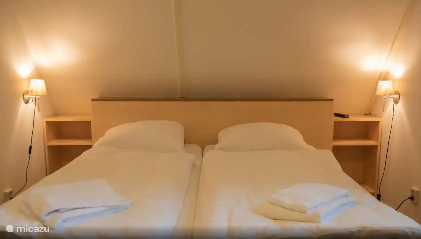 Master bedroom with flat screen TV and digital television.