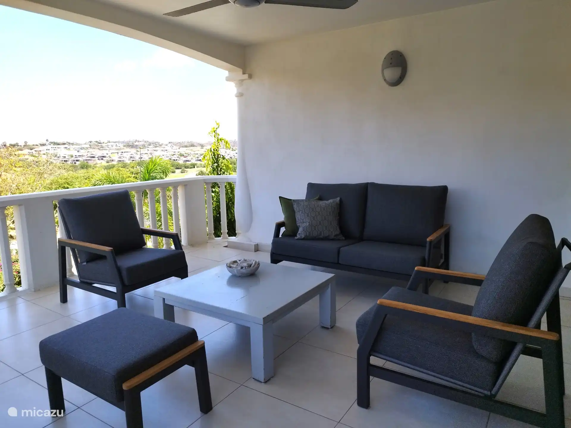 spacious balcony with a beautiful sea view.
Lounge set to relax on.