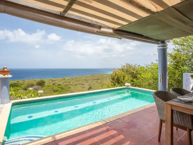 Villa Coral Breeze huren in Curaçao, Banda Abou (west), Coral Estate, Rif St.Marie - villa Overdekt terras bij zwembad met vol zeezicht