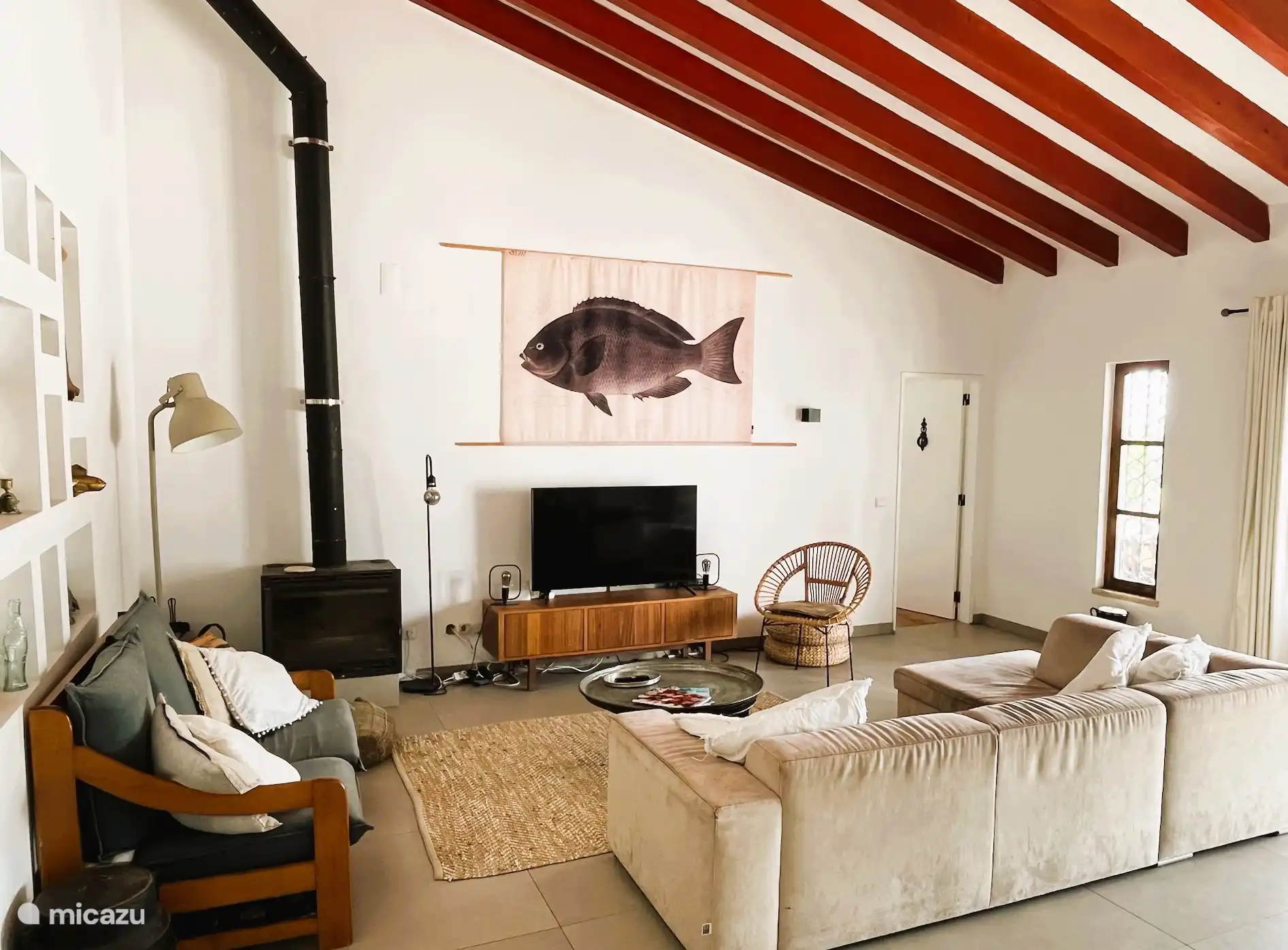 the living room with sitting area and television