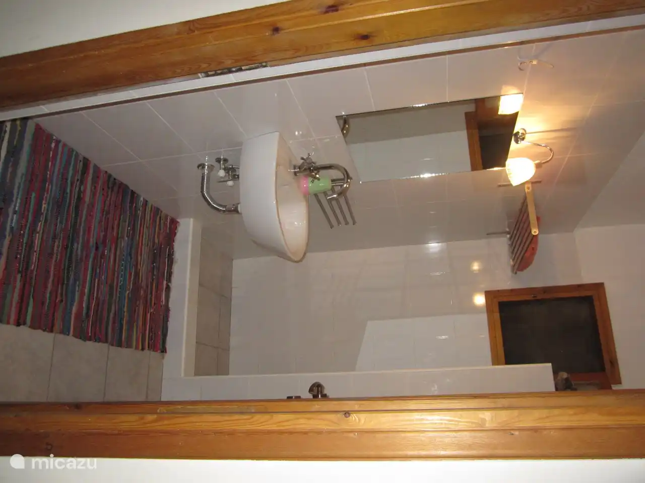 Bathroom with walk-in shower and toilet; This is located on the ground floor between the two bedrooms.