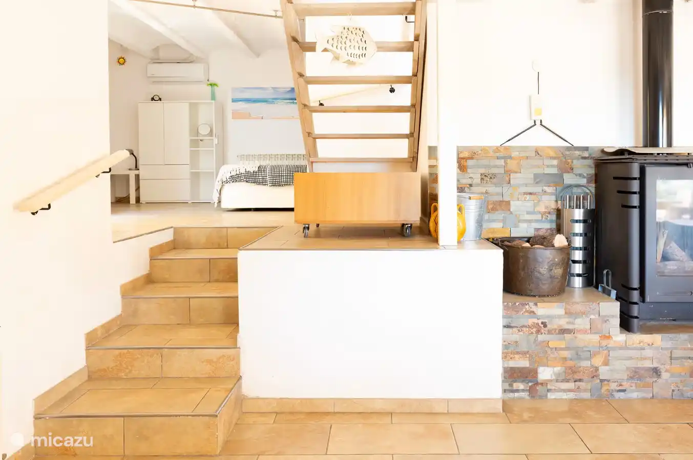 Stairs to bodega with 5th sitting bedroom with double and single bed.