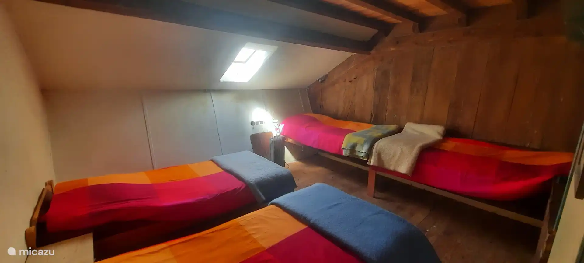 Schlafzimmer im Obergeschoss neben dem Zwischengeschoss 