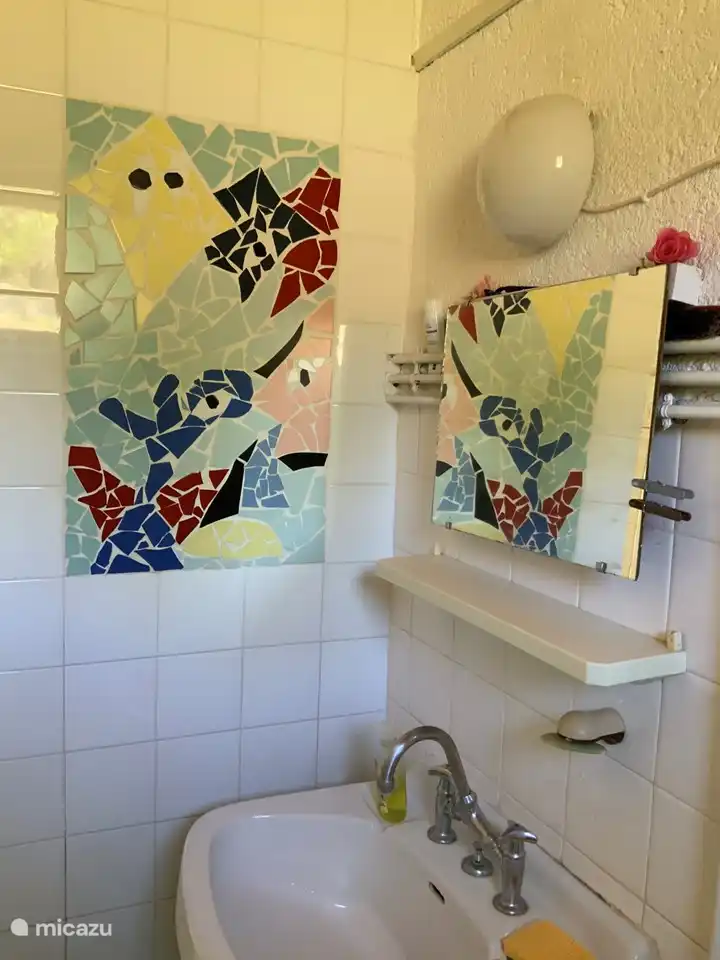 wash basin bathroom with mosaic made by the kids
