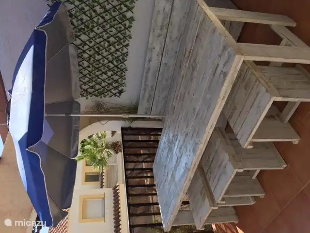 outdoor terrace with large dining table 