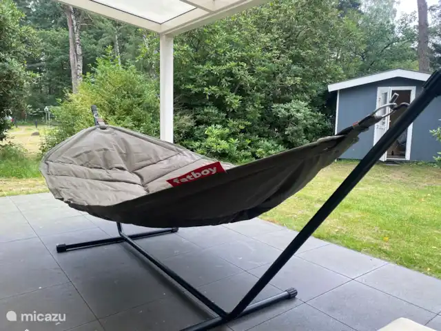 Chalet Leentje | Pays-Bas, Utrecht, Doorn - chalet Farniente toute l'année depuis le hamac sous la véranda.