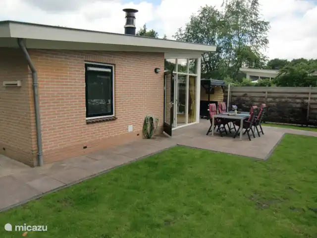 Maison de vacances 'Geel Koper' Veluwe! | Pays-Bas, Gueldre, Wells - maison de vacances La terrasse à côté du salon.