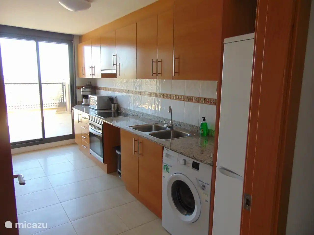 Kitchen with sliding door to the terrace