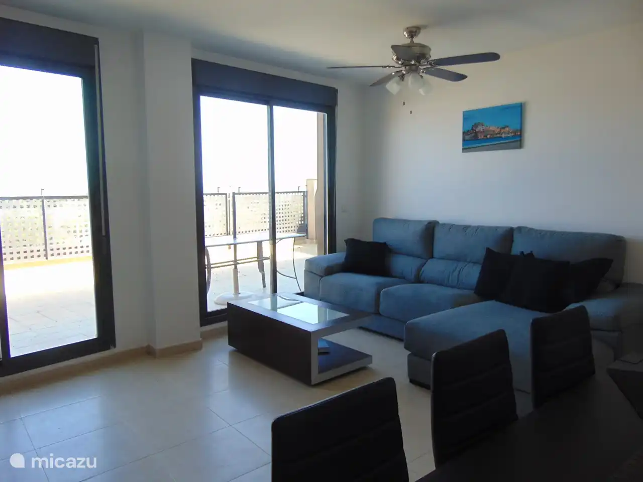 Living room with 2 sliding doors to the terrace