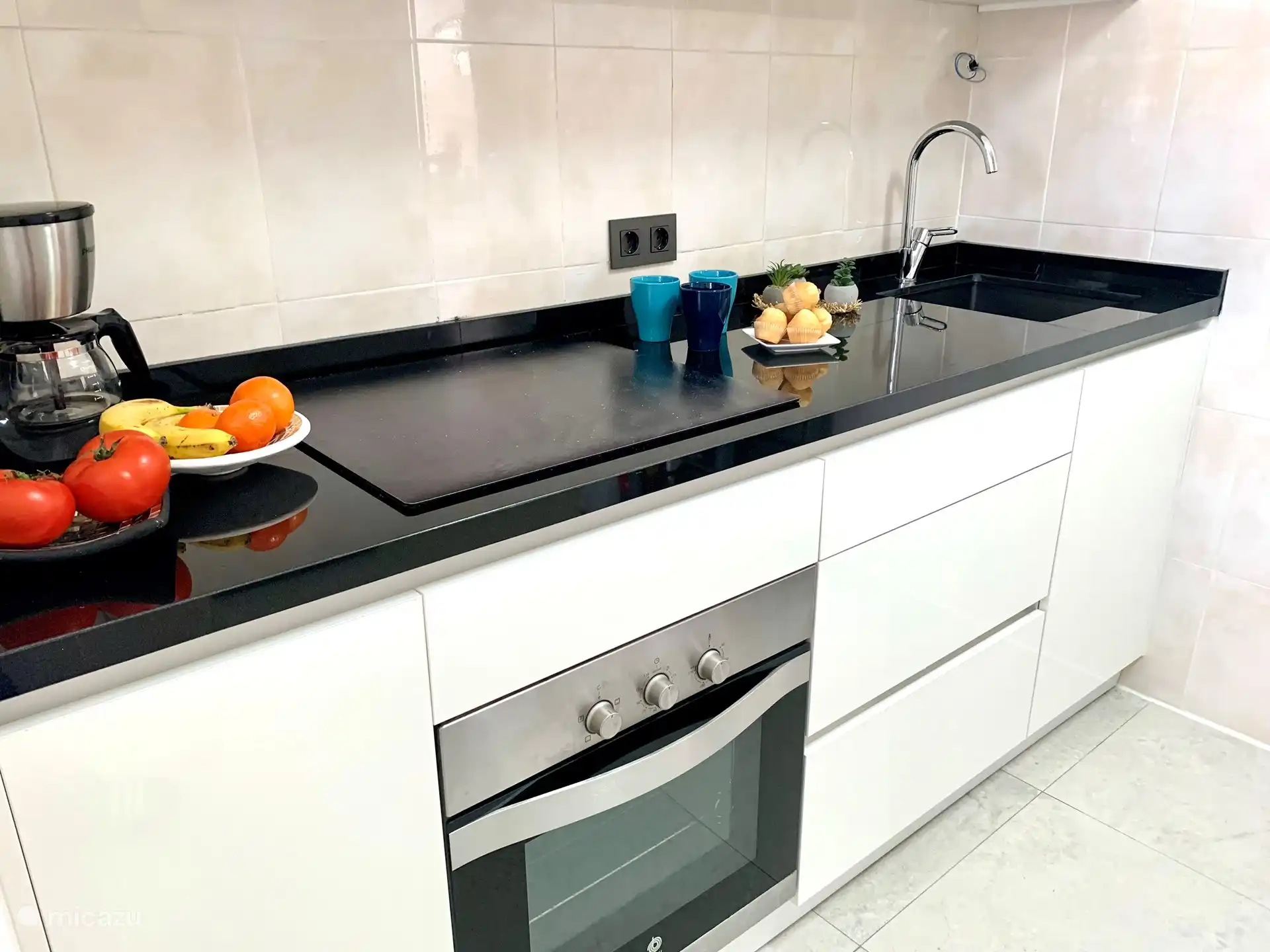 New kitchen with microwave, oven, fridge freezer