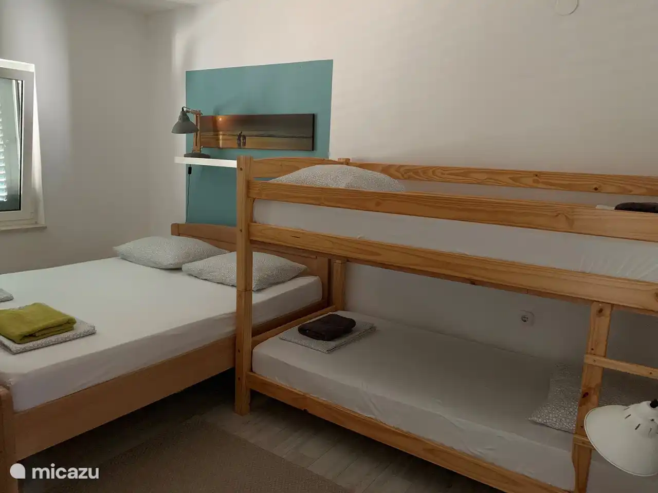 Villa Maral A1: bedroom with a double bed and bunk beds for children