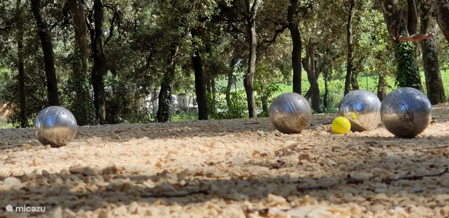 The typical French life in your own garden. Everything is there for a game of petanque.