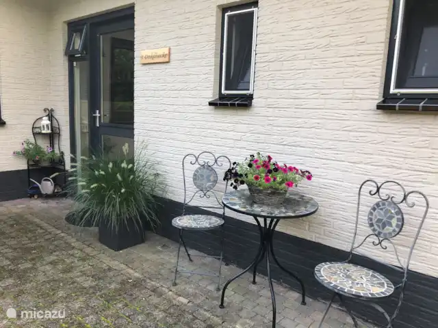 Location de Vacances Pays-Bas, Overijssel, De Lutte, maison de vacances - Dinkelhuuske L'entrée avec un siège