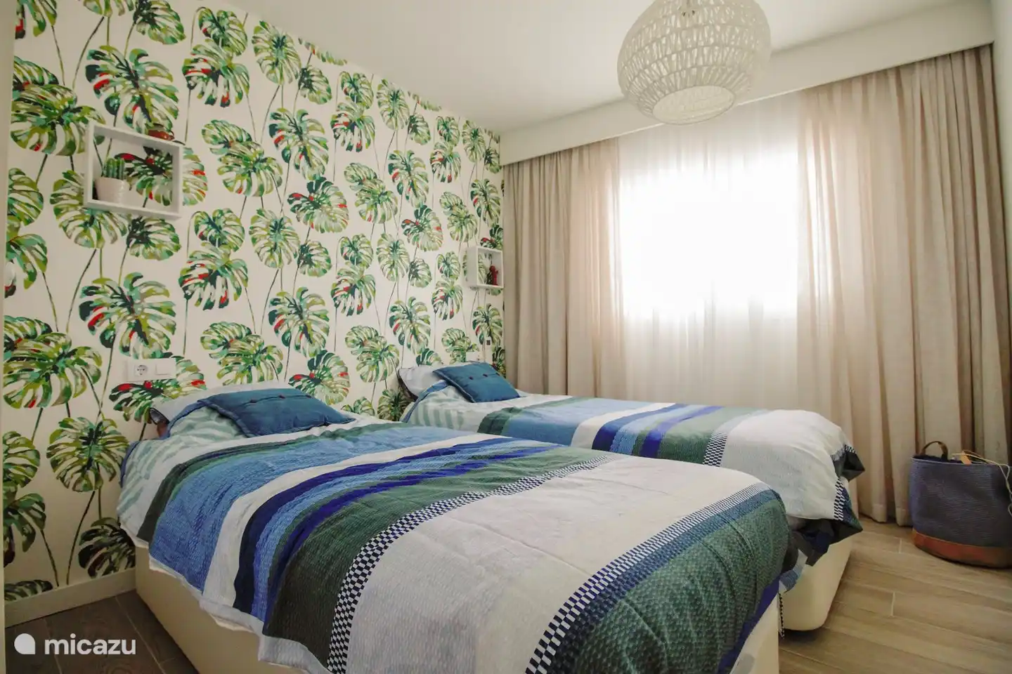 this is bedroom two with two single beds, which can be placed separately or pushed together