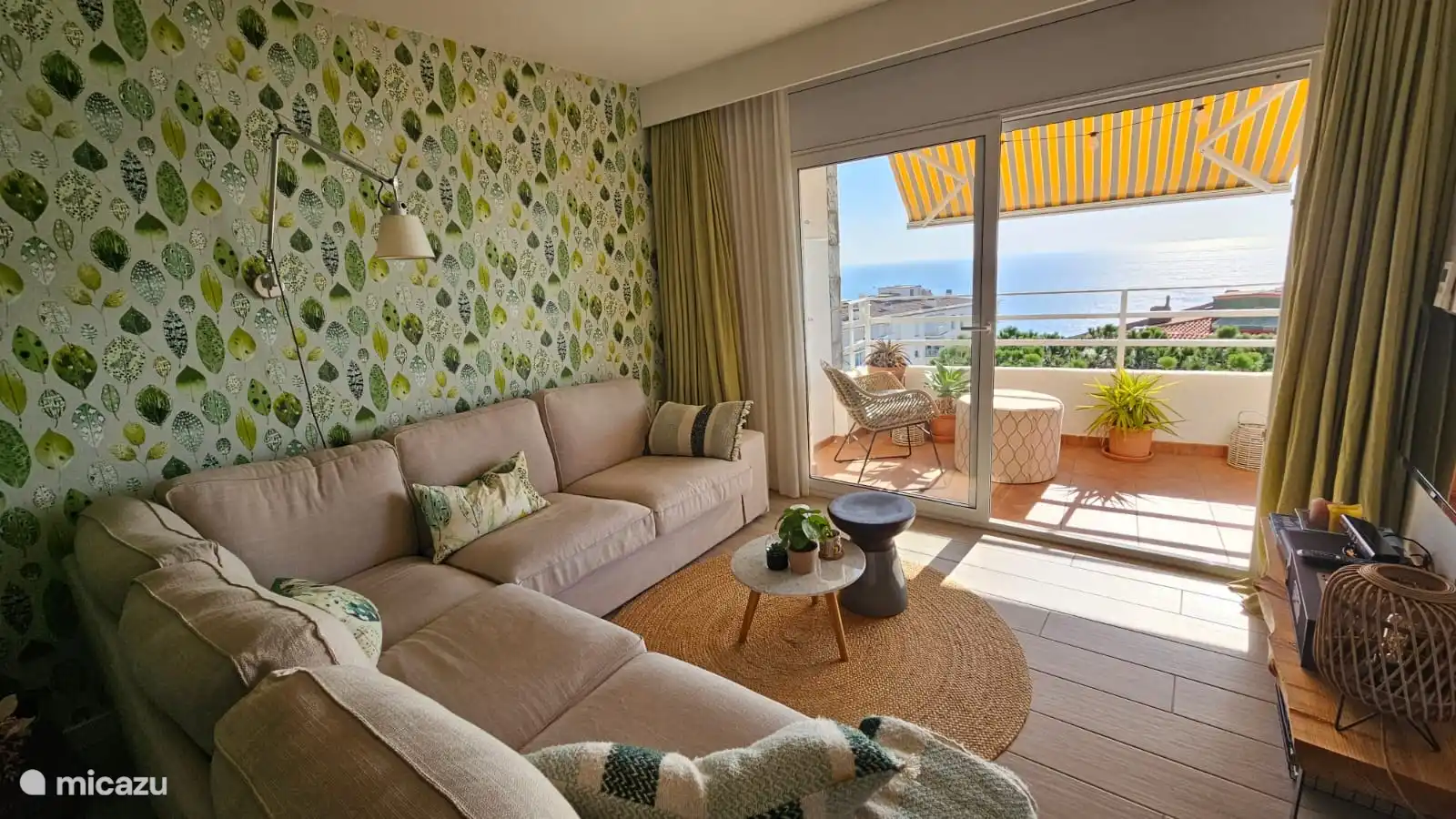 Relax on the couch looking out over the sea