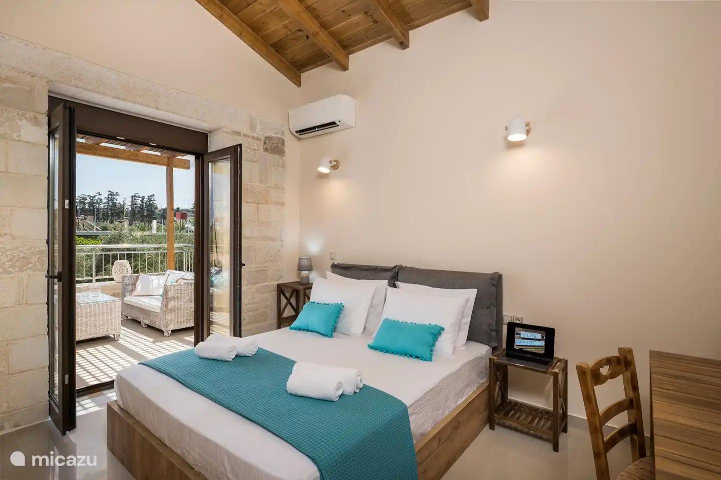 spacious bedroom with adjoining lovely large balcony.
