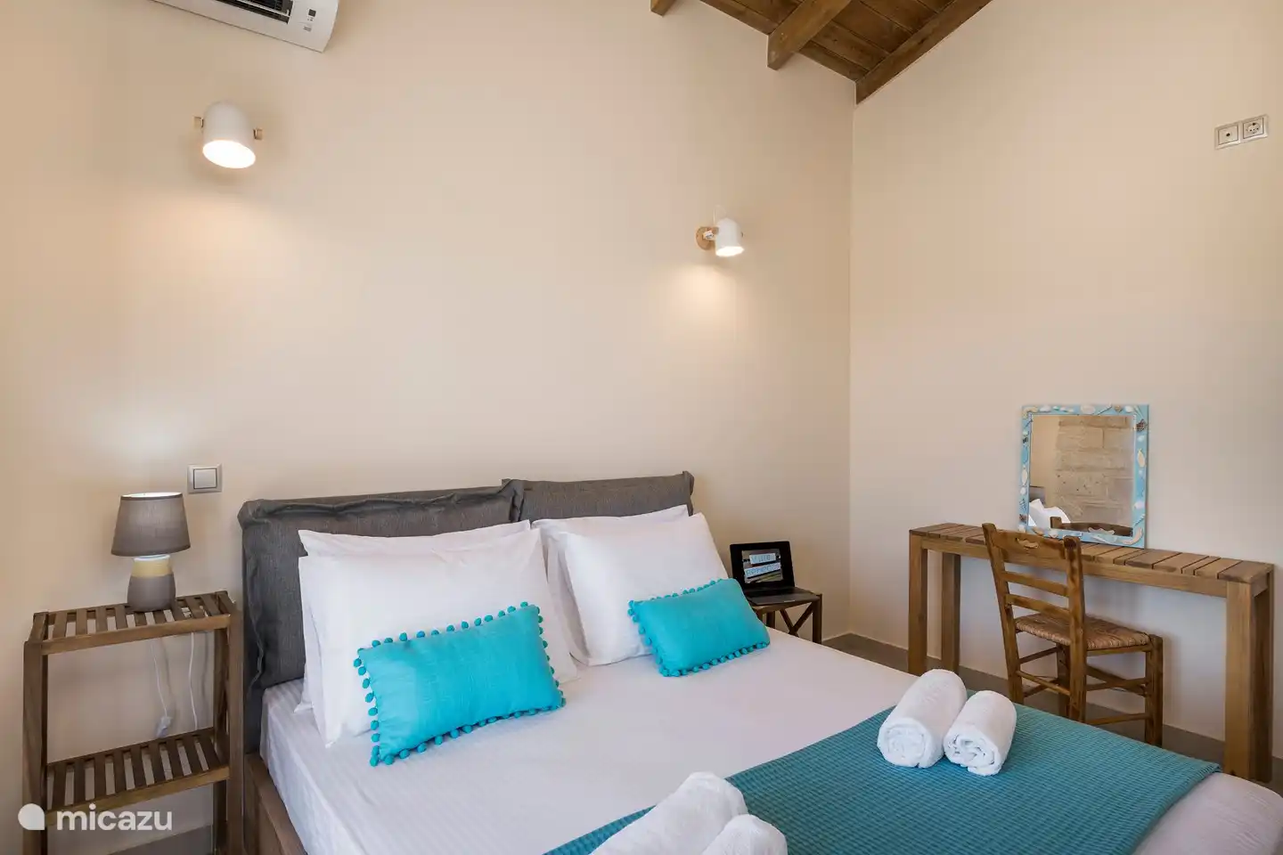 The large upstairs bedroom also has a dressing table