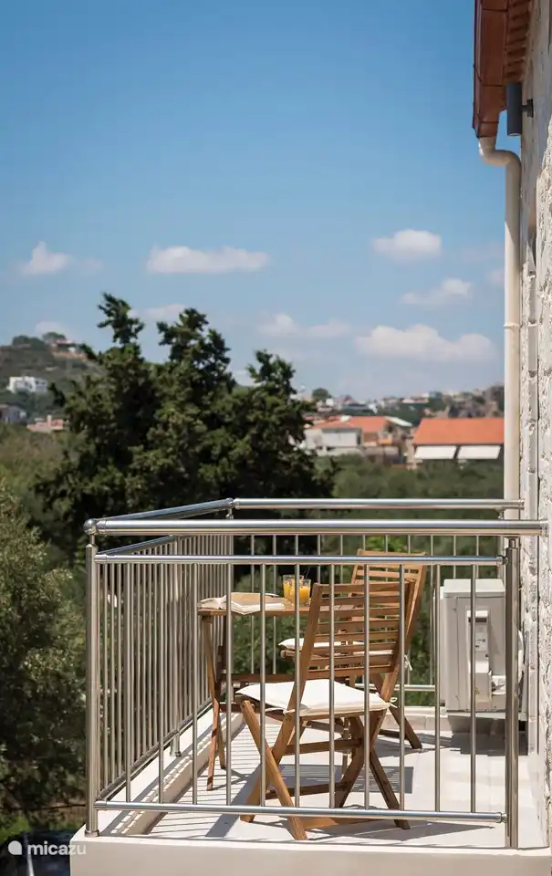 The smaller balcony on the side with beautiful views of the mountains and olive groves.