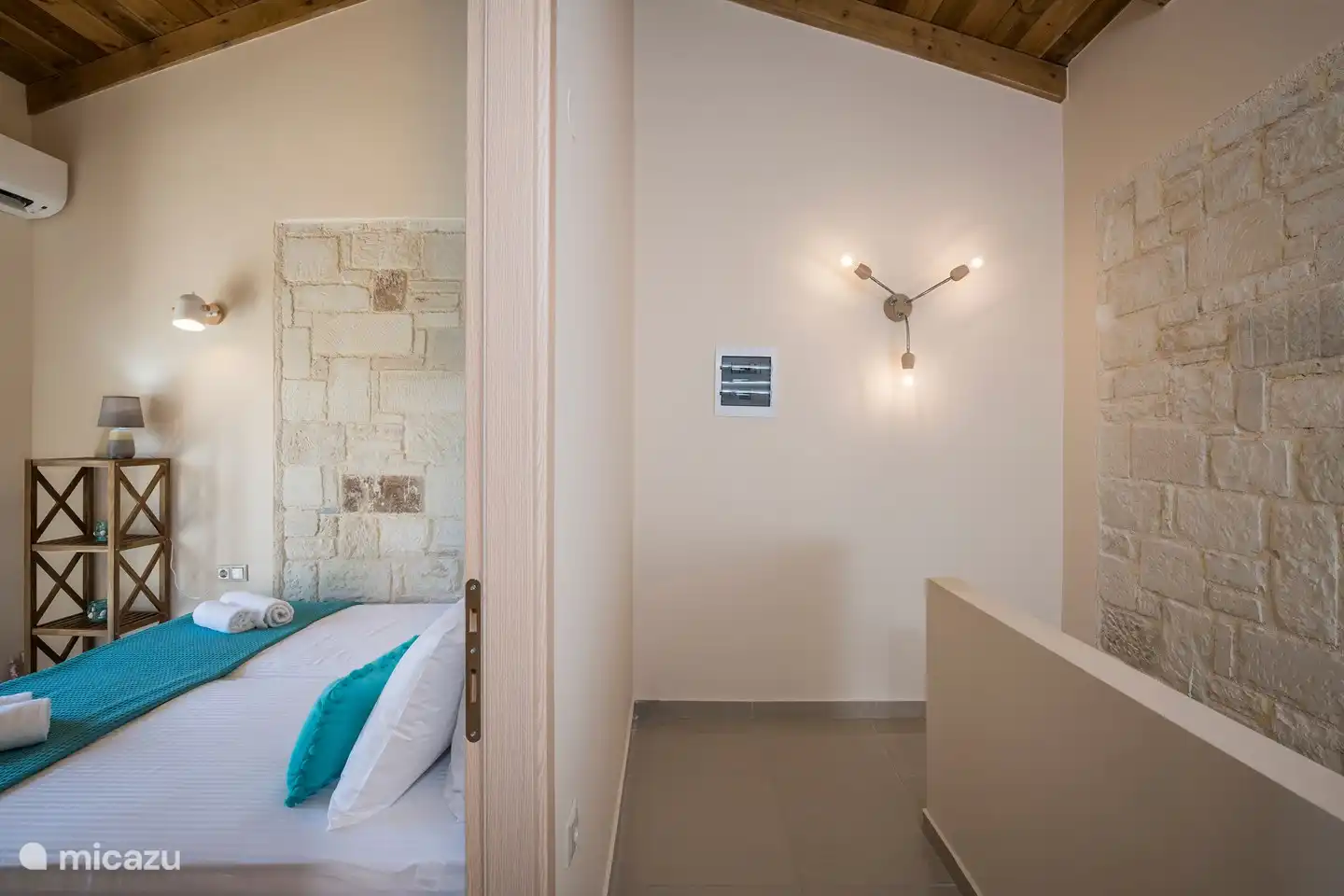 The small bedroom also has air conditioning and a large wardrobe.