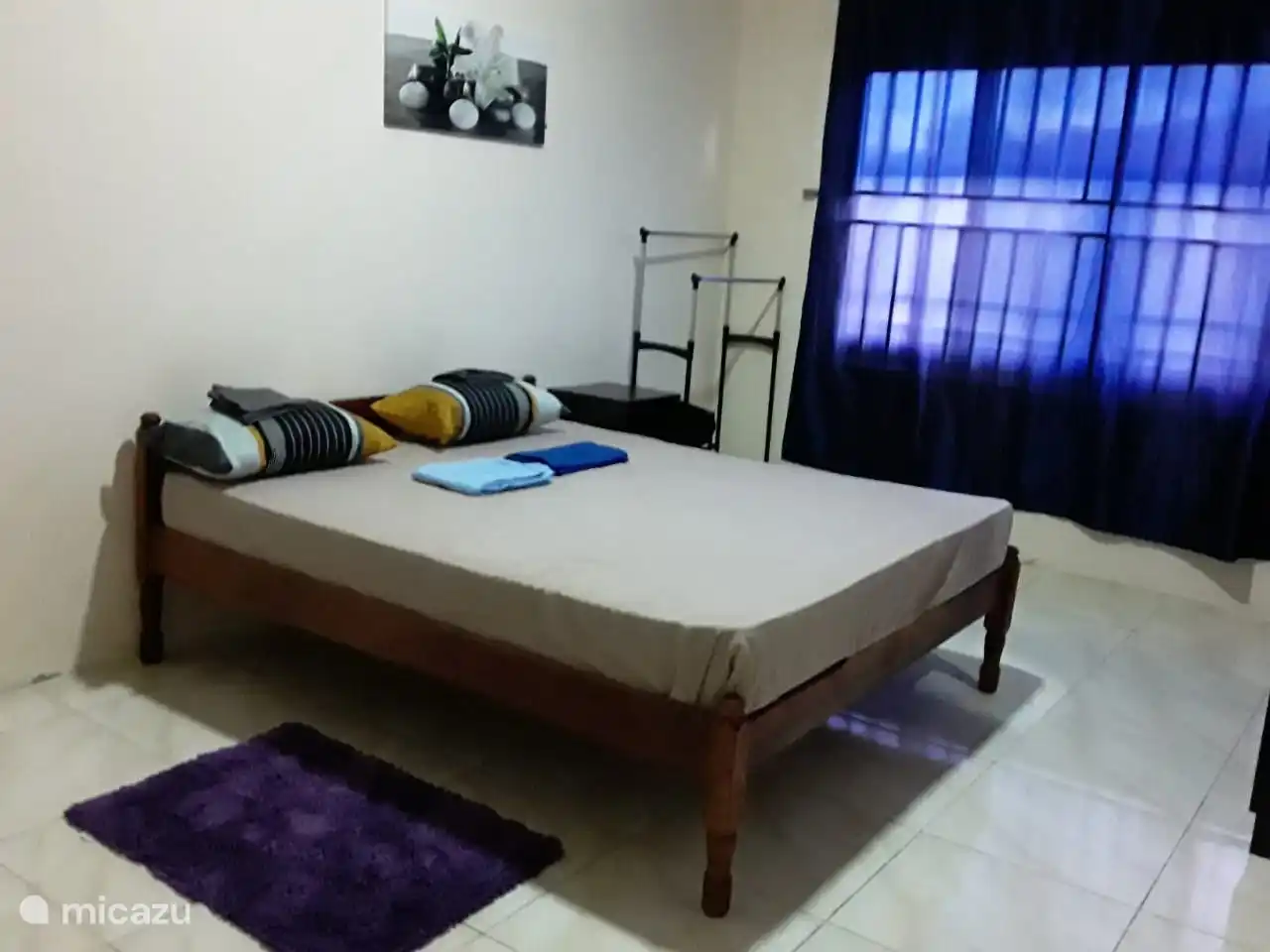 Spacious Master bed room, with air conditioning and raised ceiling.