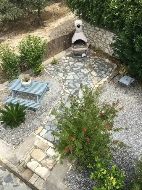 photo taken from the roof terrace, landscaped path to the BBQ, accessible via the pool or via the large side garden
