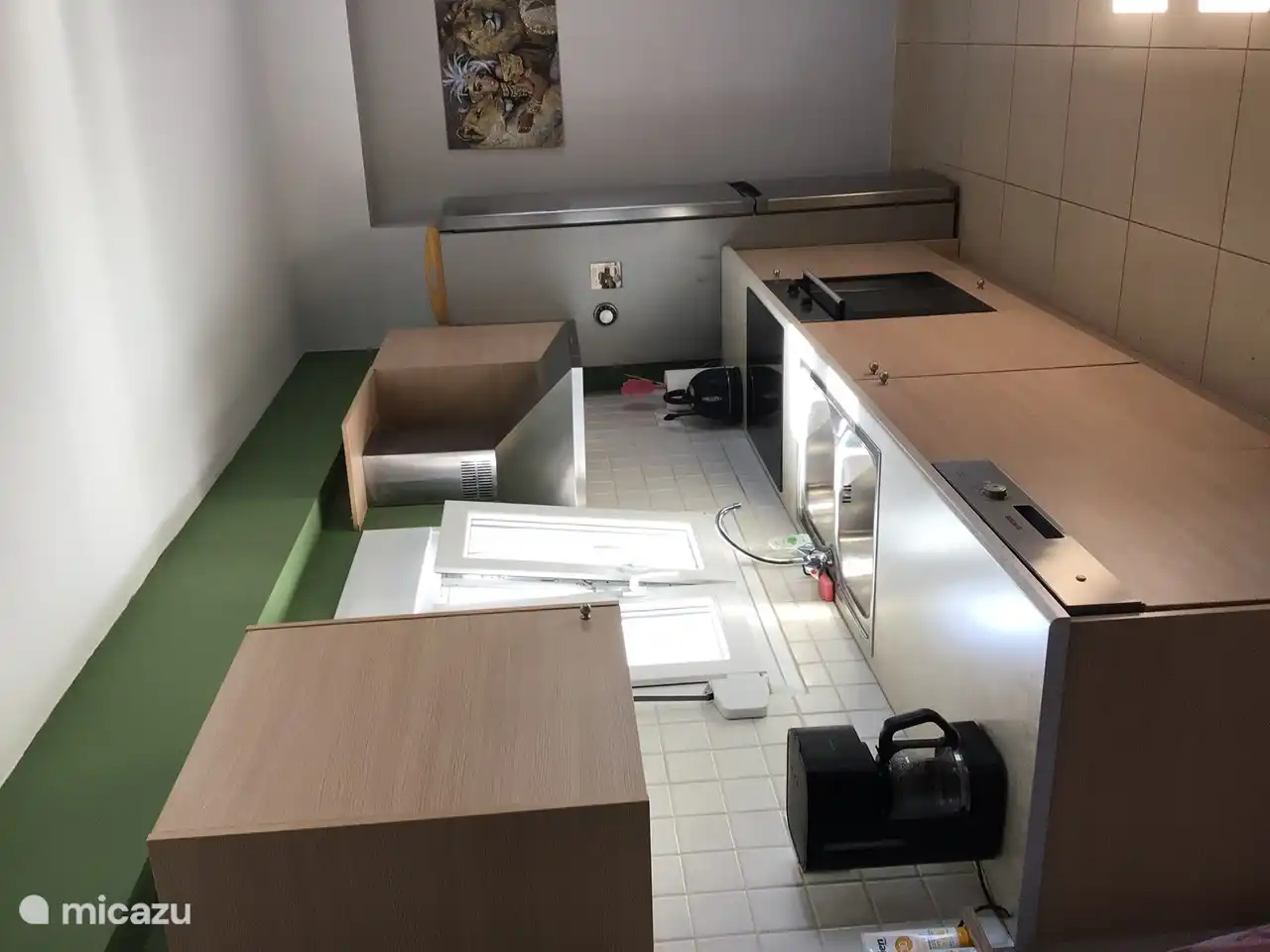 Fully equipped kitchen with dishwasher, oven, electric hob, extractor hood and large fridge / freezer.