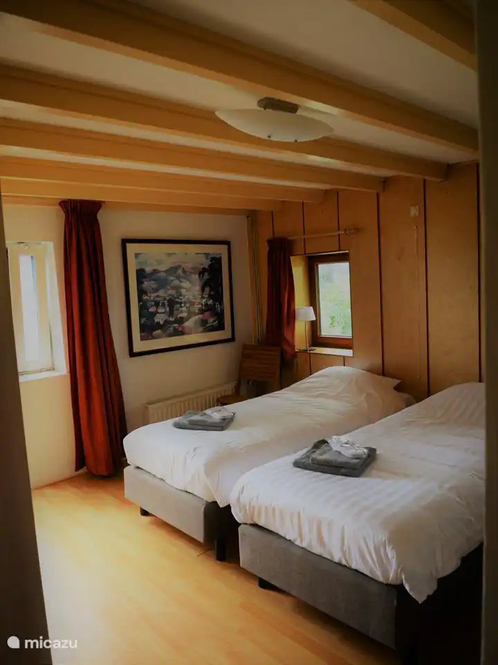 Bedroom 1 with adjacent bathroom, ground floor