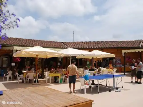 cozy central square with shops restaurant, coffee bar, tefeltennis and so on