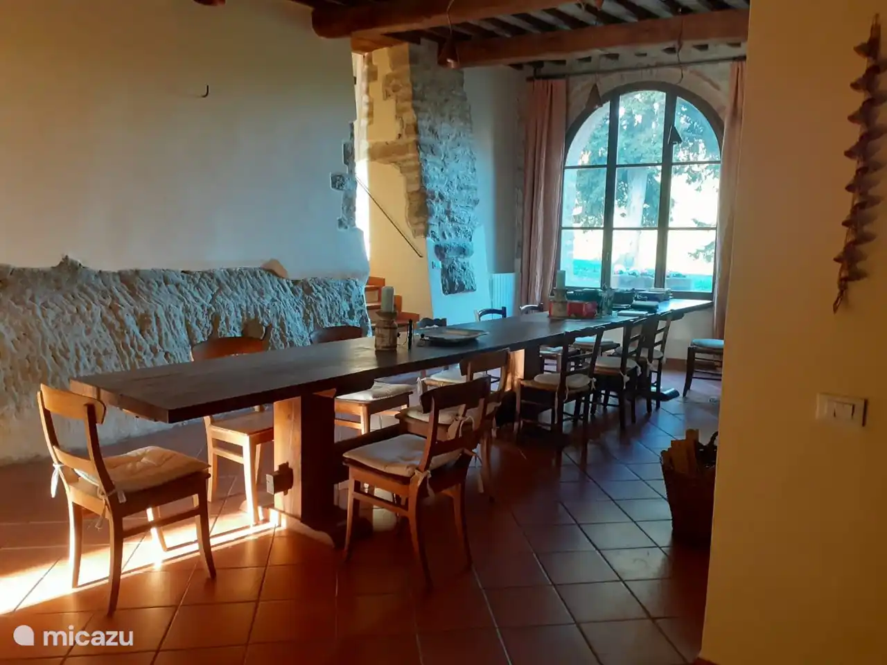 High dining room with 6 meter long chestnut wood table