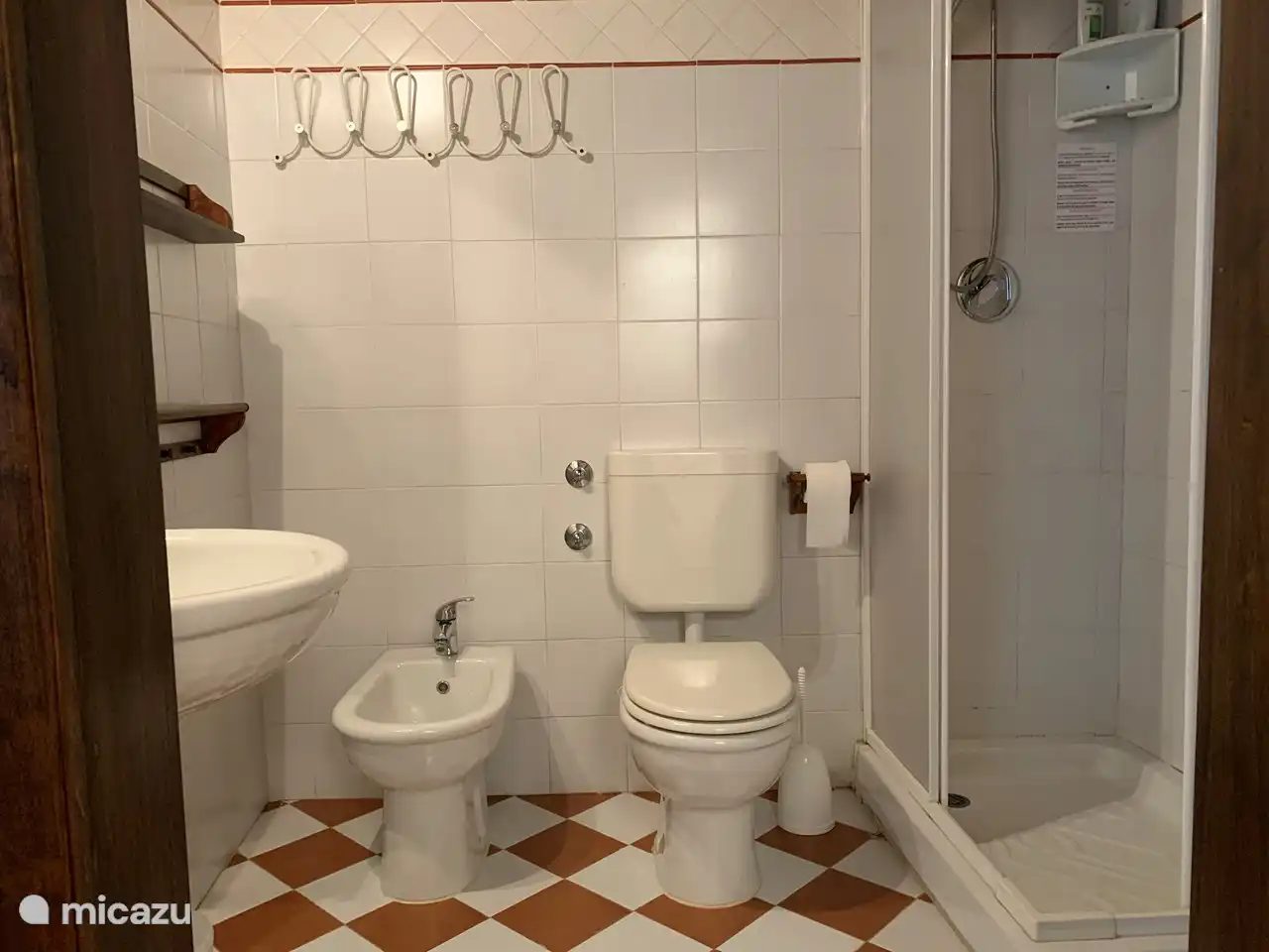 Bathroom next to bedroom 2 with shower, bidet, toilet and sink