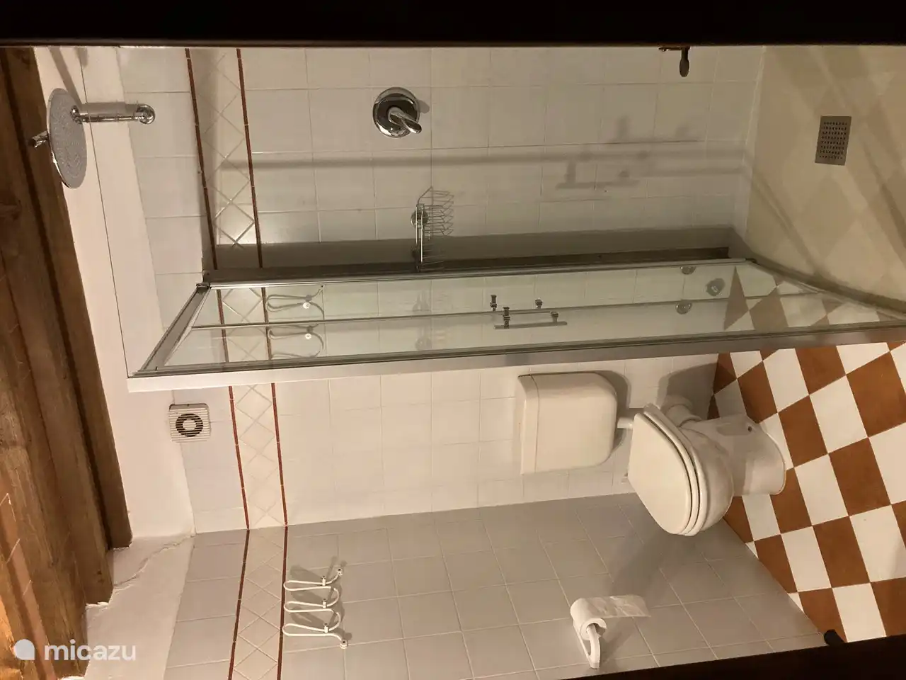 Bathroom in bedroom 3 with rain shower, toilet and sink