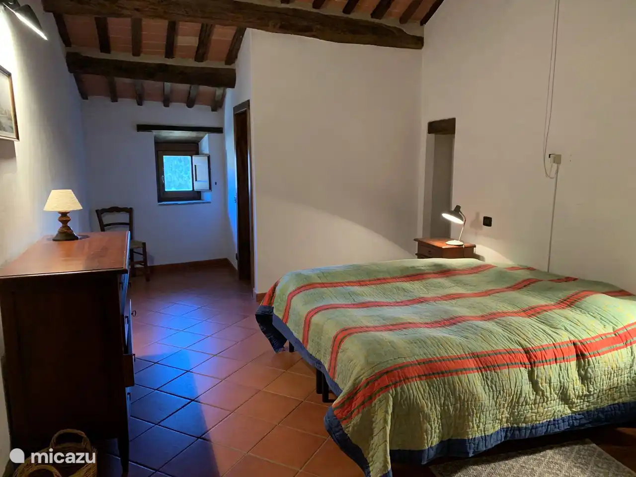 Bedroom 5 facing east with three beds. Private bathroom