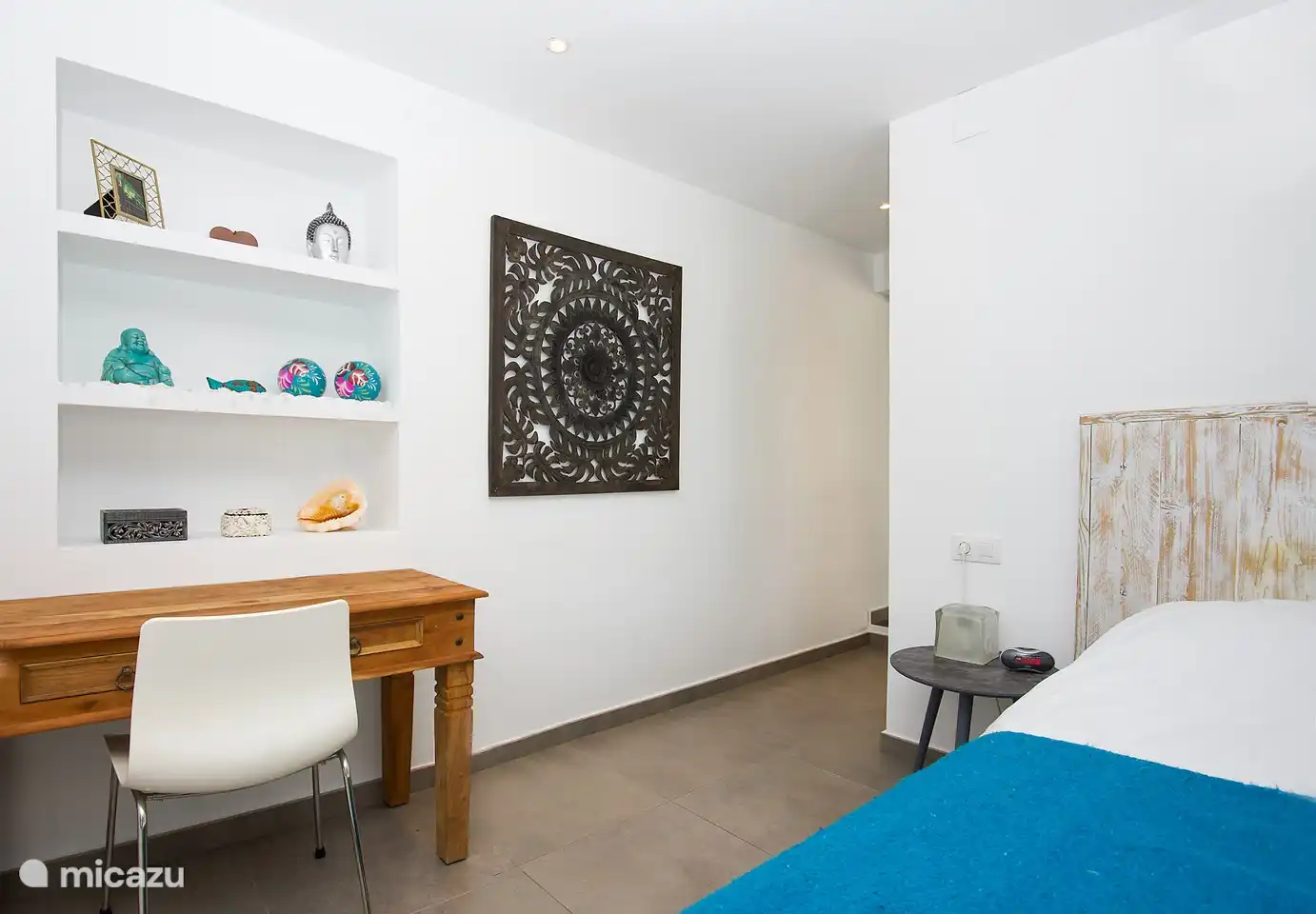 The master bedroom with a large bed of 180 x 200